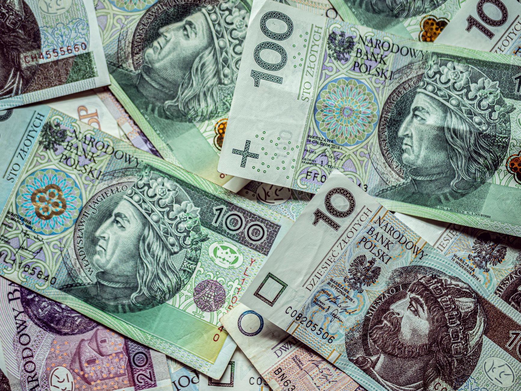 Close-up of various Polish Zloty banknotes, displaying currency and finance.