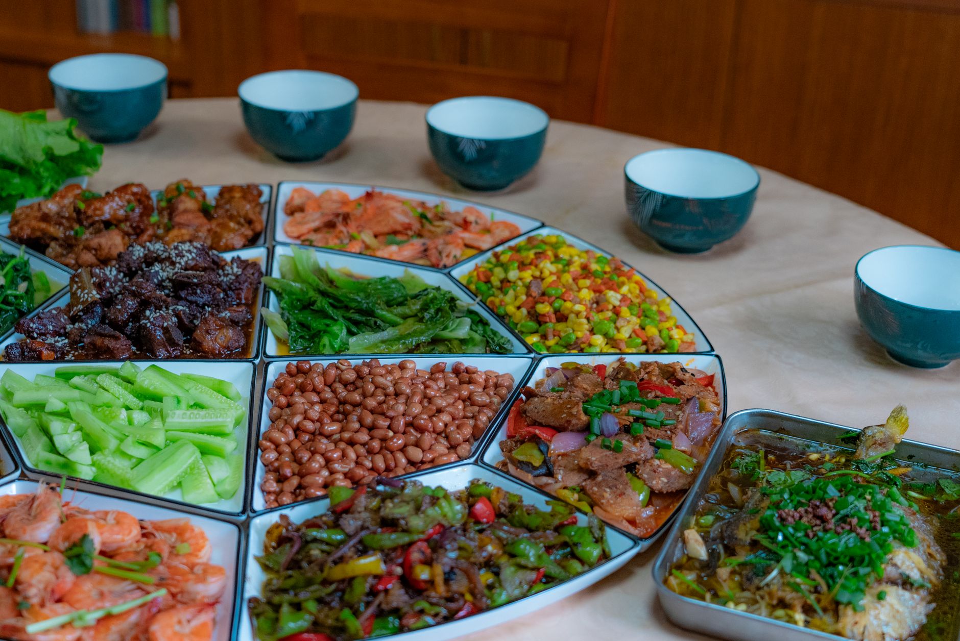 An inviting spread of traditional Chinese dishes arranged on a round table setting.